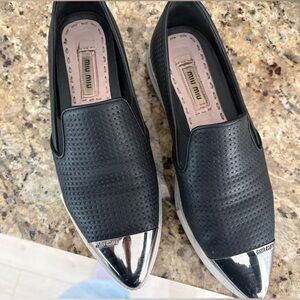 Miu Miu Black Perforated Leather Slip-On Sneakers | Metal Cap Toe